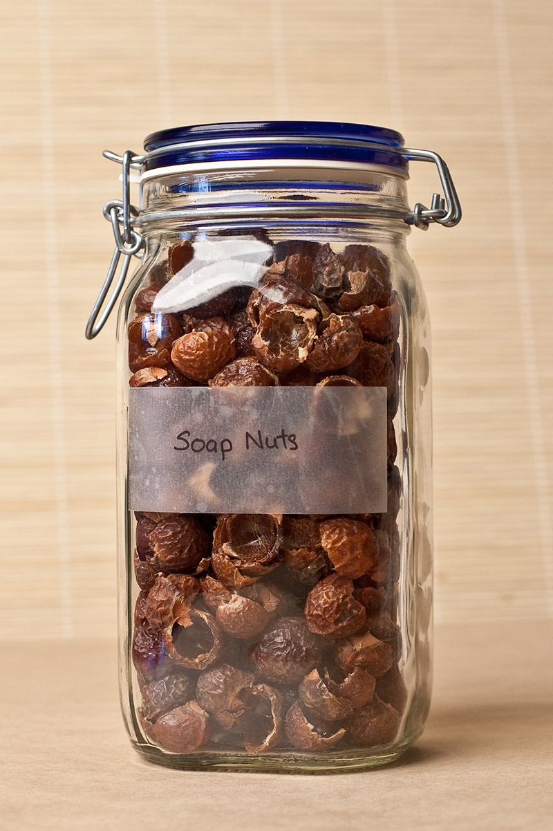 soap nuts stored in a glass bottle